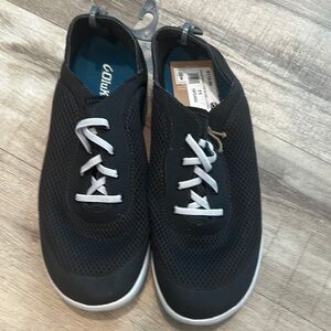OluKai Black and White Slip-On Sneakers